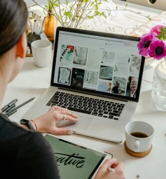 photo of person using laptop for graphic designs